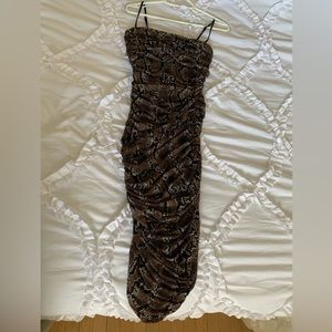 Aritzia: Babaton snake-print, ruched dress.